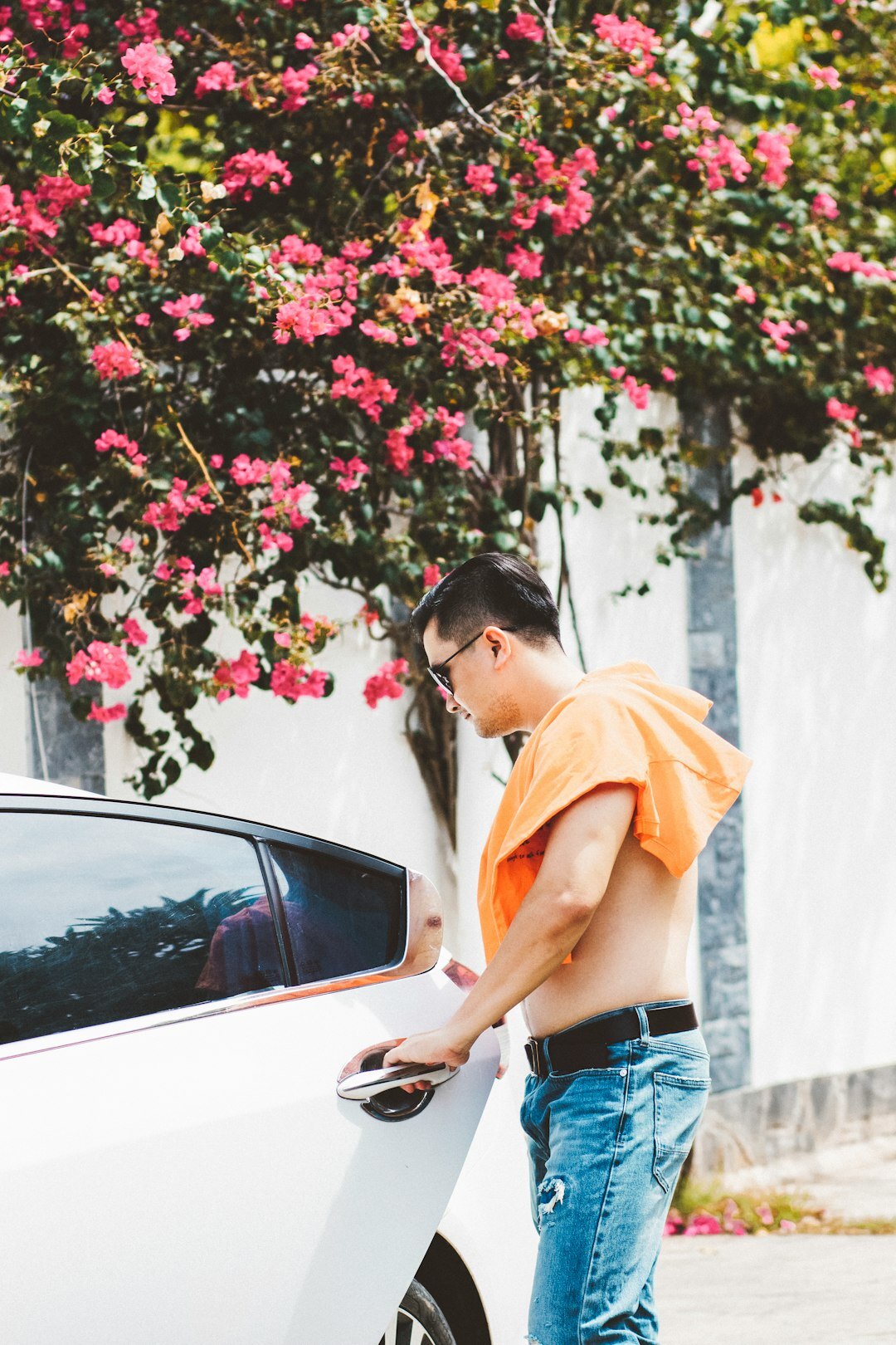 person inspecting used car