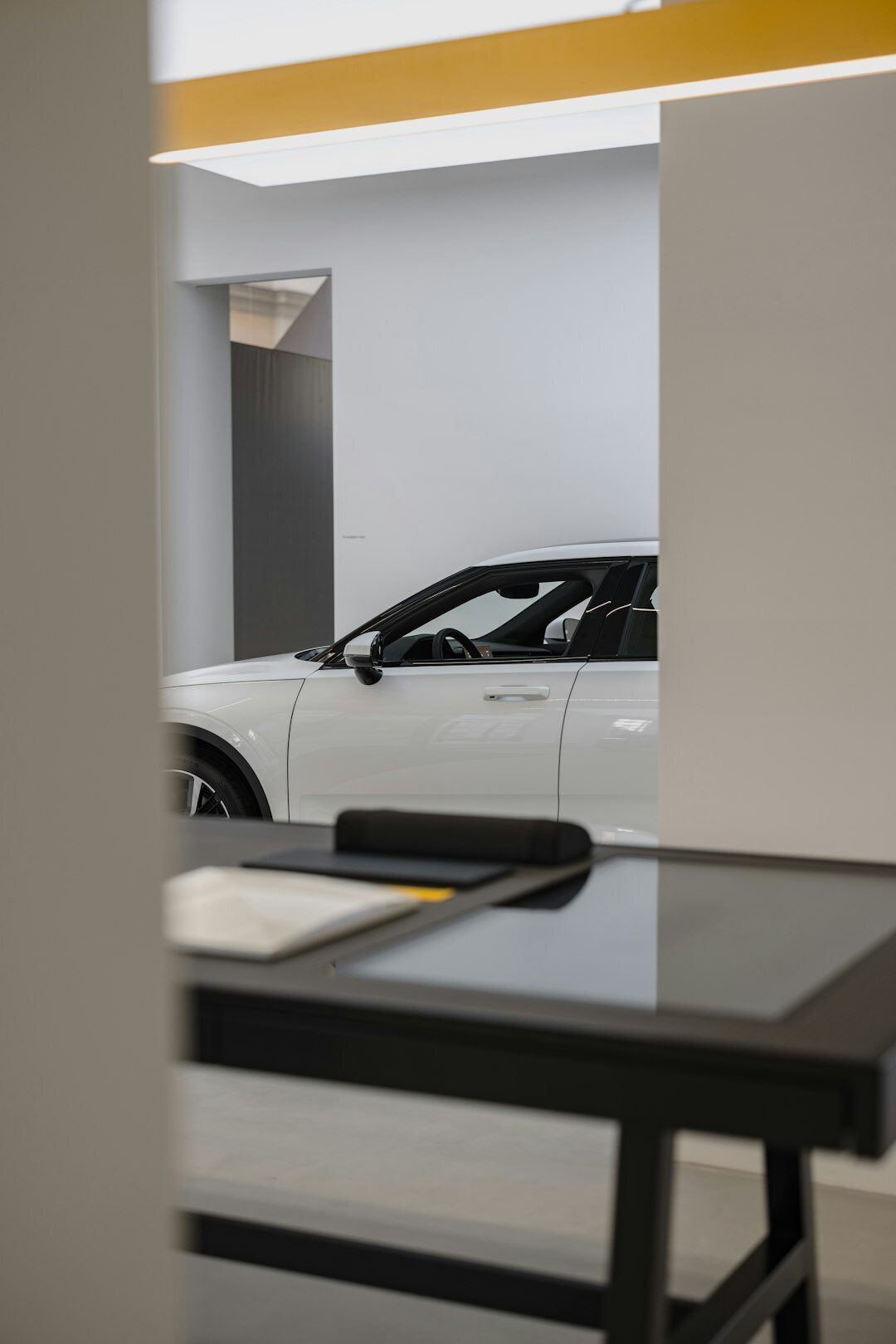 Modern editorial office space with automotive magazine layouts on a desk
